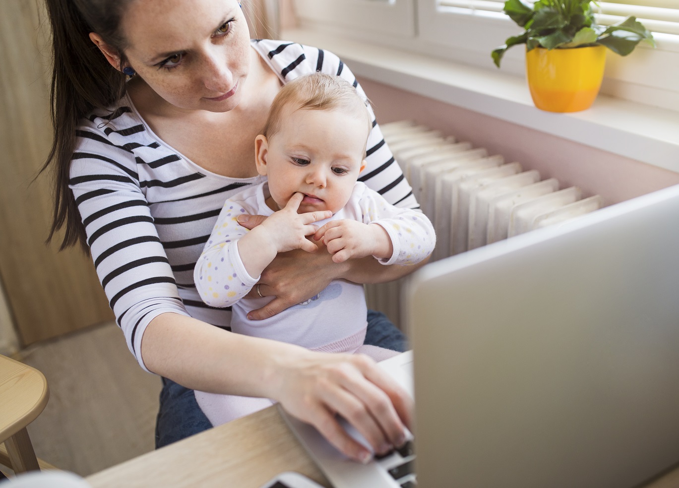 Young mother working from home